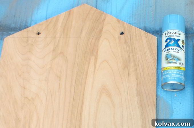 Drilling holes for the pull ropes on the front of the DIY sleds