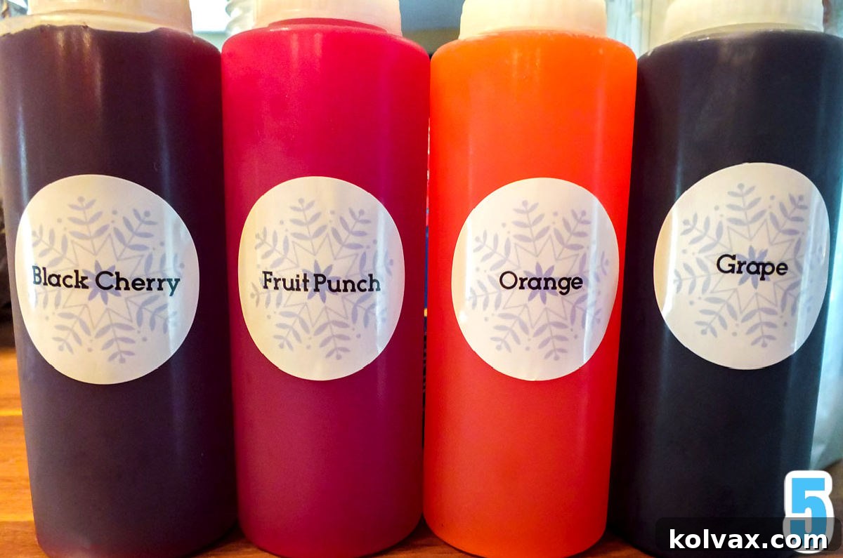 Plastic squeeze bottles filled with colorful homemade snow cone syrup