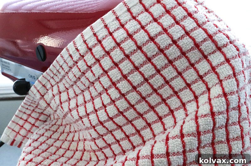 Mixing powdered sugar and butter on low speed in an electric mixer to prevent messes.