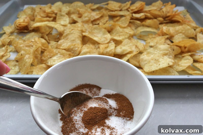 Mixing granulated sugar and ground cinnamon in a small bowl to create cinnamon sugar.