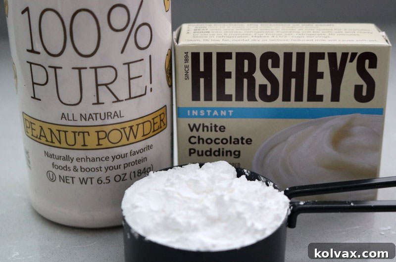 A visual display of all the key ingredients needed to prepare the Best Peanut Butter Whipped Cream Frosting, including heavy cream, powdered sugar, peanut powder, and instant pudding mix, ready for mixing.