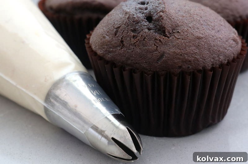 A visual guide illustrating the quantity of The Best Peanut Butter Whipped Cream Frosting, suitable for frosting a sheet cake, a two-layer round cake, or multiple cupcakes, depending on application method.