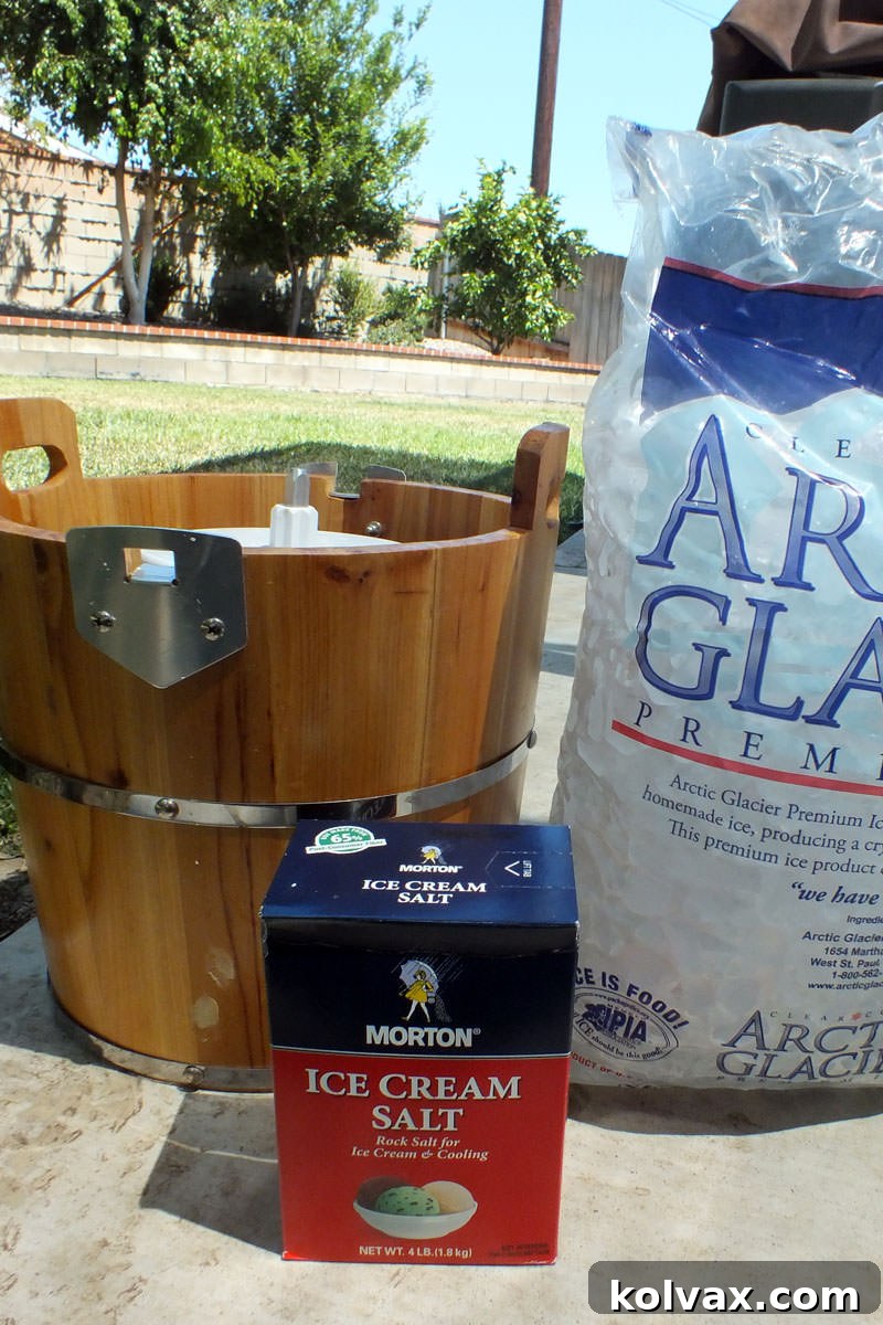 An electric ice cream maker setup with a bag of ice and rock salt, ready for churning homemade ice cream.