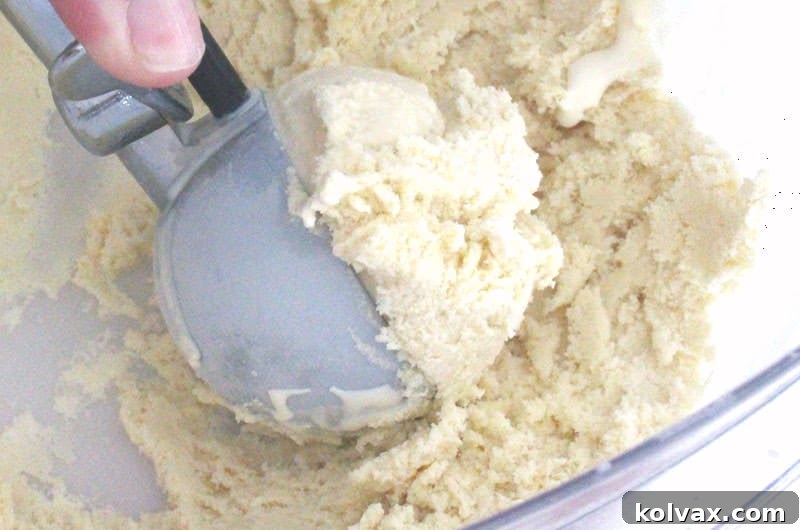 A tightly covered container of homemade vanilla ice cream, chilling in the freezer to harden.