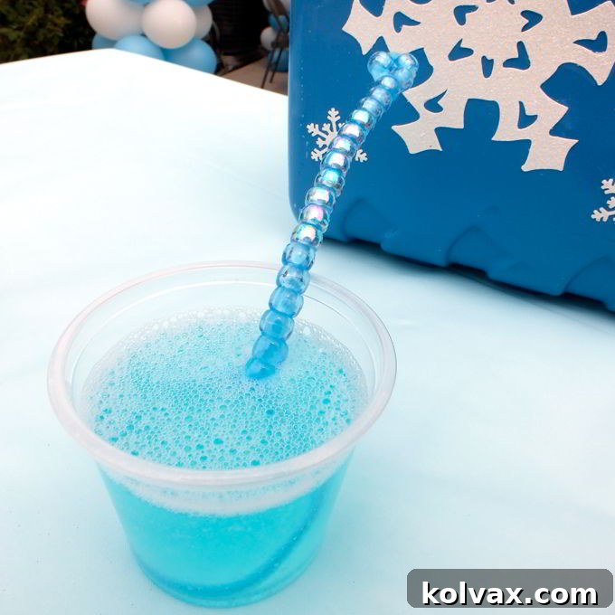 A stunning close-up of a DIY Bubble Wand, featuring beautiful beadwork, perfectly integrated into the whimsical decor of our Disney Frozen Party.