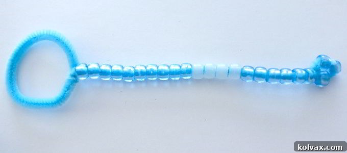 Behold the completed DIY Bubble Wand, a charming and sturdy creation ready to produce countless magical bubbles at your Disney Frozen party.