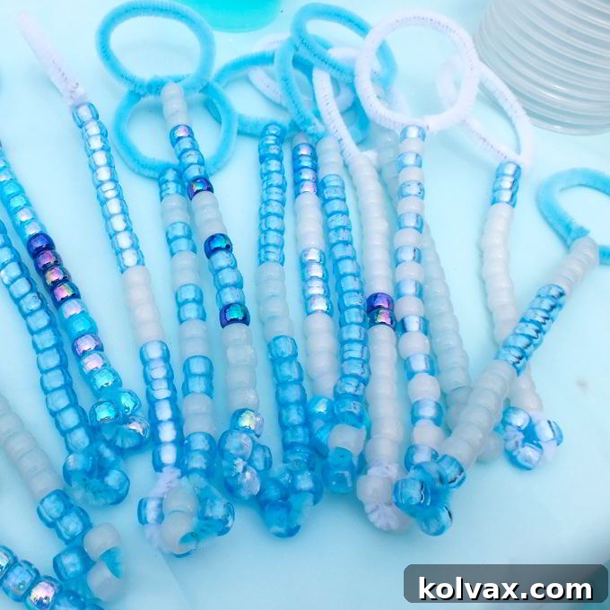 A delightful display of homemade DIY Bubble Wands, showcasing a variety of bead patterns, all set to sparkle and shine at a vibrant Frozen Birthday Party.