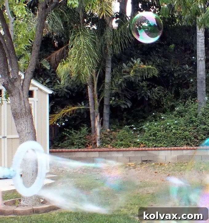 Children excitedly blowing a cascade of large, sturdy, and beautiful bubbles using their custom-made DIY Bubble Wands, creating a scene of pure joy.