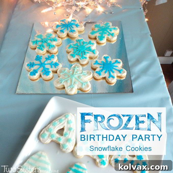 Frozen Snowflake Cookies displayed on a silver foil cake board, completing the magical Frozen-themed dessert table.