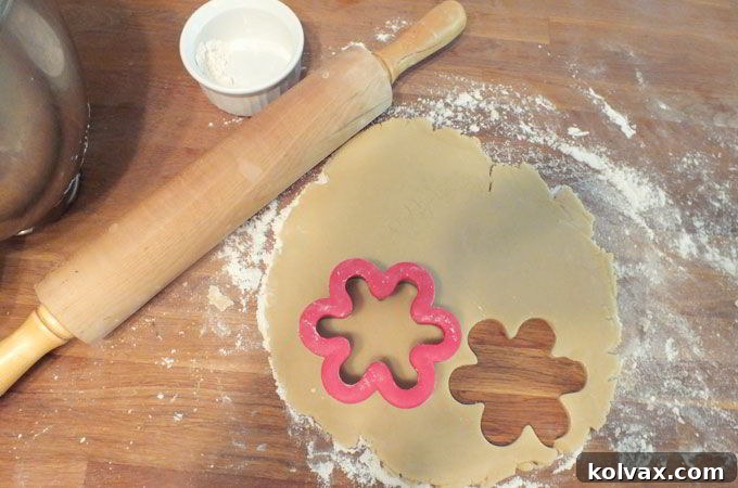 Making Disney Frozen Snowflake Cookies starts with our best sugar cookie dough, rolled out and ready for cutting.