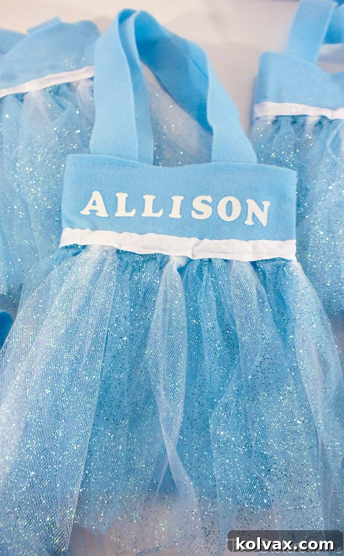 Disney Frozen Elsa Party Favor Bags - These DIY party favor bags were the hit of our Frozen Birthday Party. Pretty, sparkly and fit for an ice queen, the girls at the party loved them. Follow us for more fantastic Frozen Party Ideas.