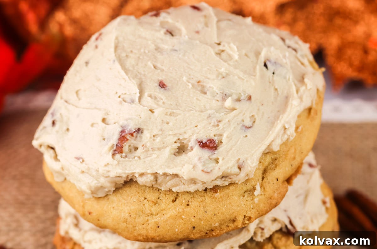 Closeup on a Sweet Potato Cookie frosted with Maple Pecan Frosting, showcasing its rich texture and decadent topping.