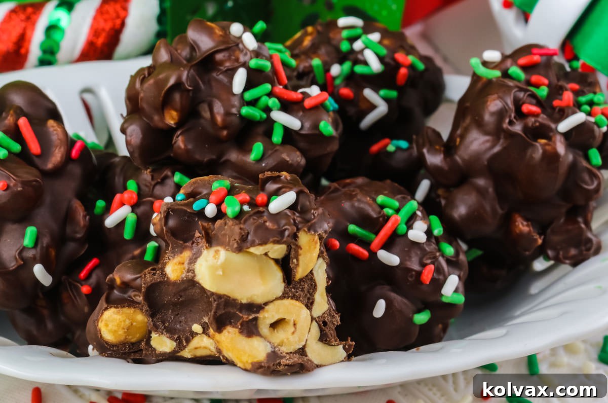 Closeup on a batch of Christmas Peanut Clusters on a white dessert dish.