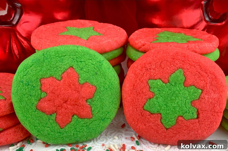 Vibrantly colored red and green two-tone holiday butter cookies on a cooling rack, ready to be enjoyed.