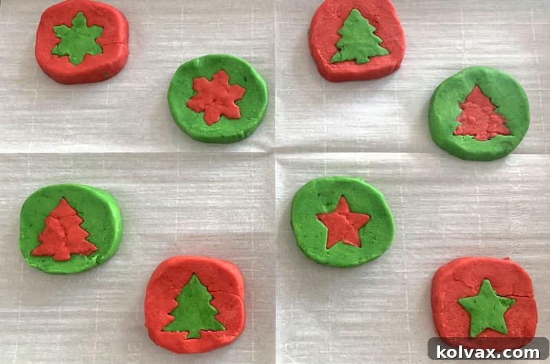 Cookie sheet filled with intricately designed two-tone Holiday Butter Cookies, ready for the oven.