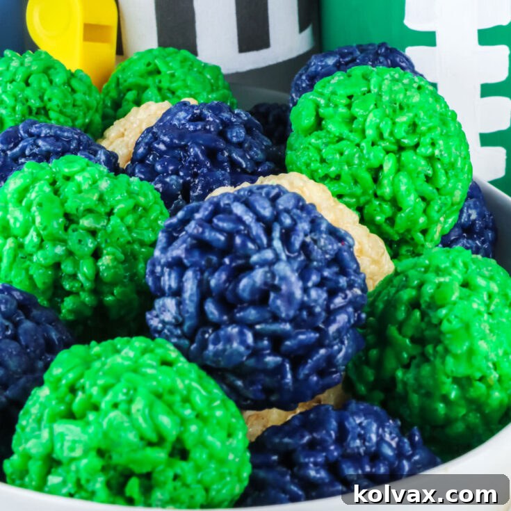 Closeup on a batch of Seattle Seahawks Rice Krispie Bites served in a white ceramic bowl.