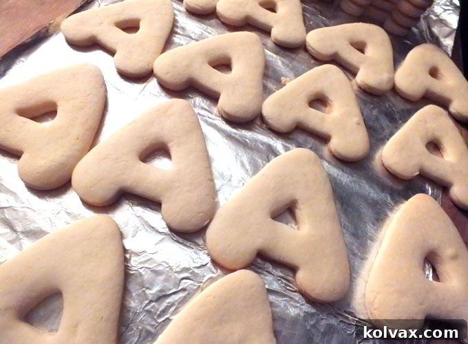 Freshly baked sugar cookies in letter A and number 4 shapes