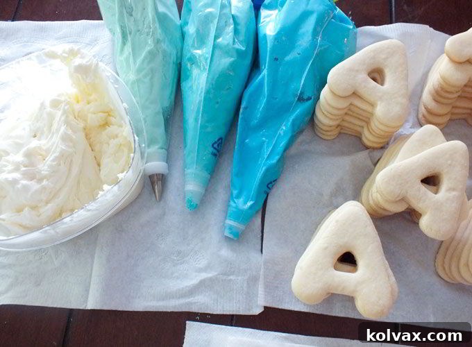Preparing the sugar cookies for frosting with various shades of blue buttercream