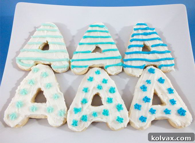 Plate of 'A' shaped cookies decorated with ombre blue frosting