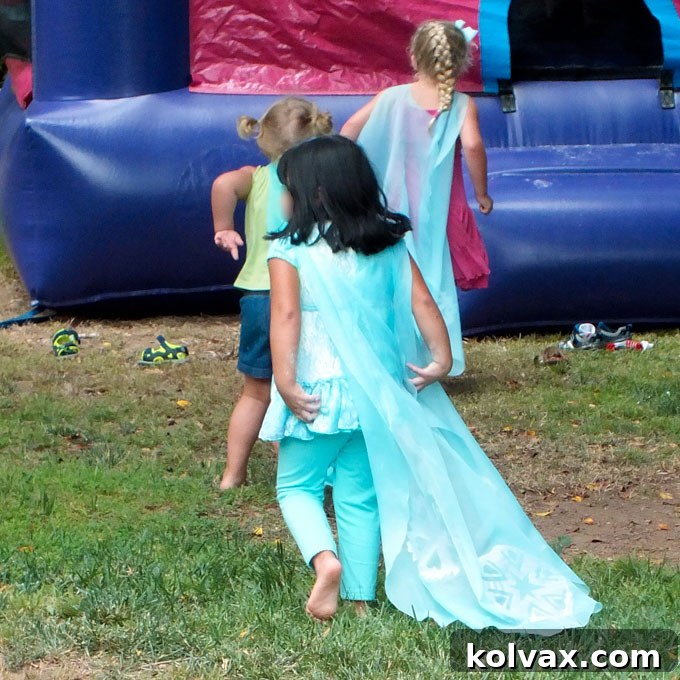 Girls Enjoying DIY Elsa Capes at Frozen Party