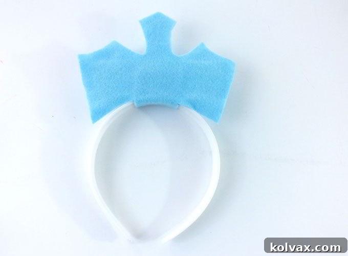 The completed Frozen Elsa Crown base, attached to the headband and ready for glittering embellishments.