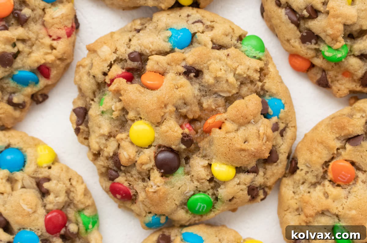 Ultimate Soft and Chewy Monster Cookies 2 Close-up image of a perfectly baked Monster Cookie, still warm from the oven, showcasing its rich texture and colorful M&M's.