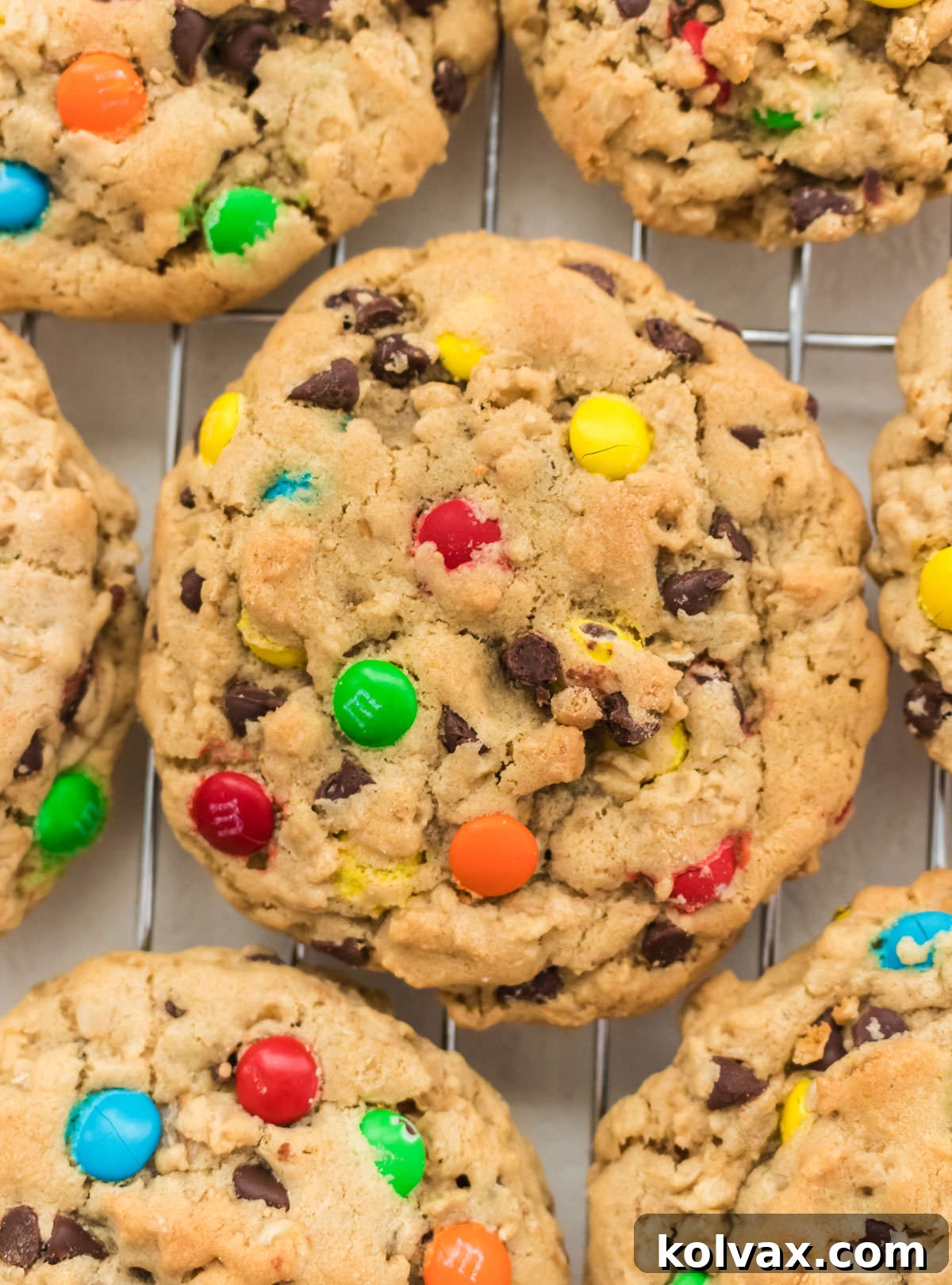 Ultimate Soft and Chewy Monster Cookies 7 Close up of a single, perfectly baked Monster Cookie sitting on a wire cooling rack, ready to be enjoyed.