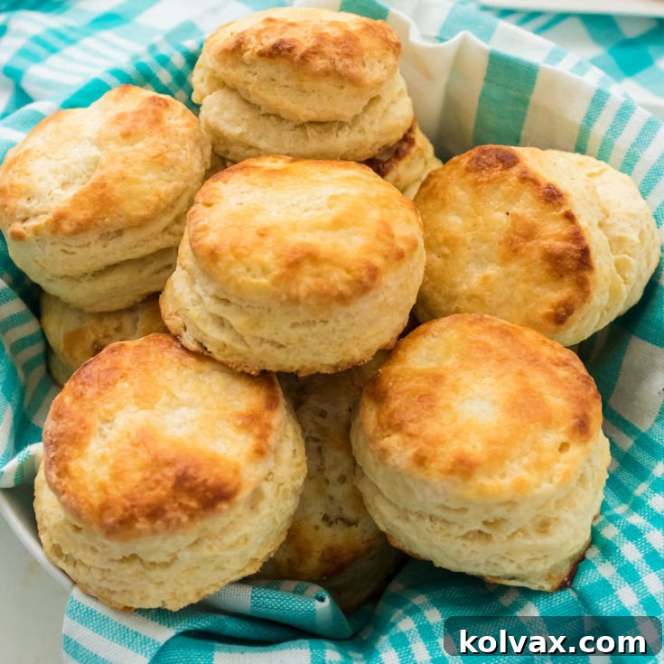 A beautifully presented batch of Buttermilk Biscuits, golden brown and stacked, with a print button overlay.