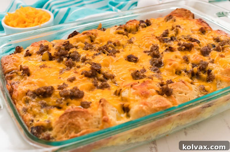 A delicious and hearty Sausage Breakfast Casserole with eggs, sausage, cheese, and fluffy biscuits, perfect for special occasions or a leisurely Sunday morning.