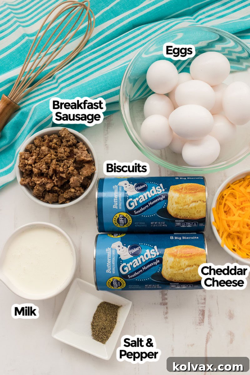 A vibrant image showcasing all the fresh ingredients needed for a Sausage Breakfast Casserole, including golden refrigerated biscuits, fresh eggs, savory breakfast sausage, rich cheddar cheese, a splash of milk, and essential salt and pepper.