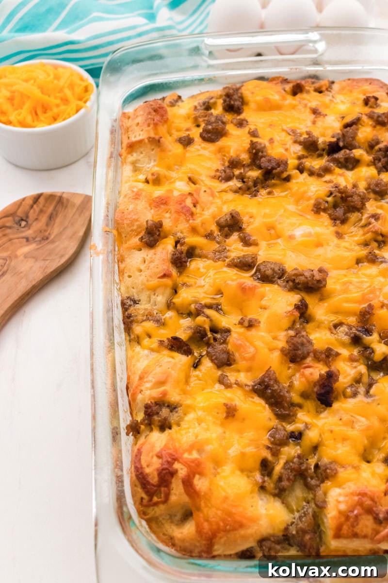 A beautiful top-down shot of the fully baked Sausage Breakfast Casserole, garnished and ready to be served, highlighting its golden-brown crust and inviting texture.