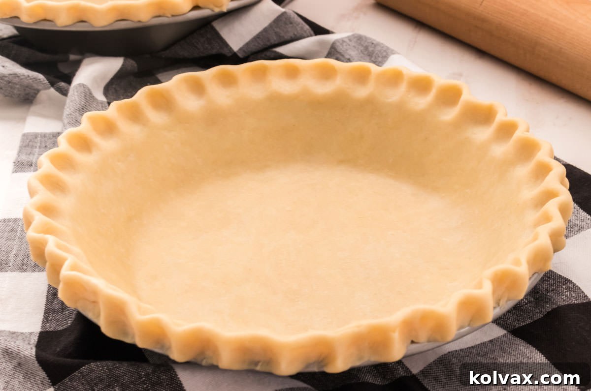 A beautifully golden-brown, homemade pie crust, promising flaky perfection and rich buttery flavor.