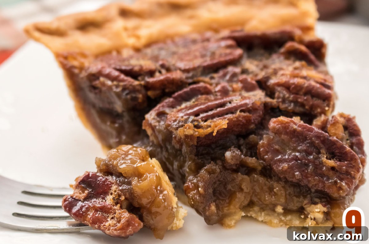 A slice of golden pecan pie on a white plate with a fork taking a bite, showcasing the gooey filling and crunchy pecans.