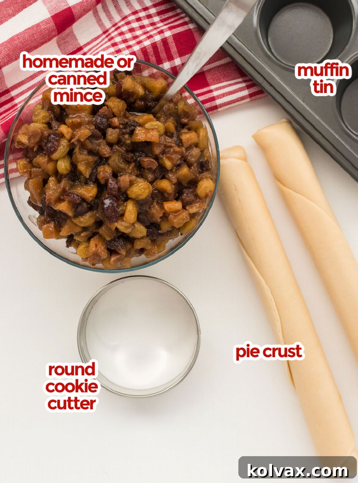 Bite-sized Festive Mince Pies 3 All the ingredients you will need to make Mini Mince Pies including a bowl of mincemeat, pie crust sheets, a muffin tin, and a round cookie cutter.