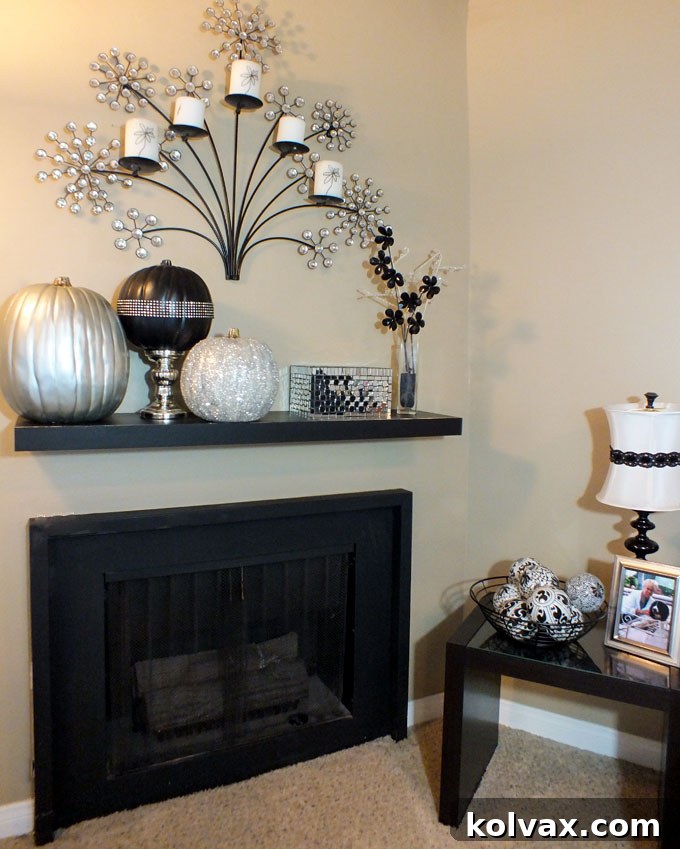 Living room Halloween decorations featuring elegant Black and Silver Pumpkins on a mantle
