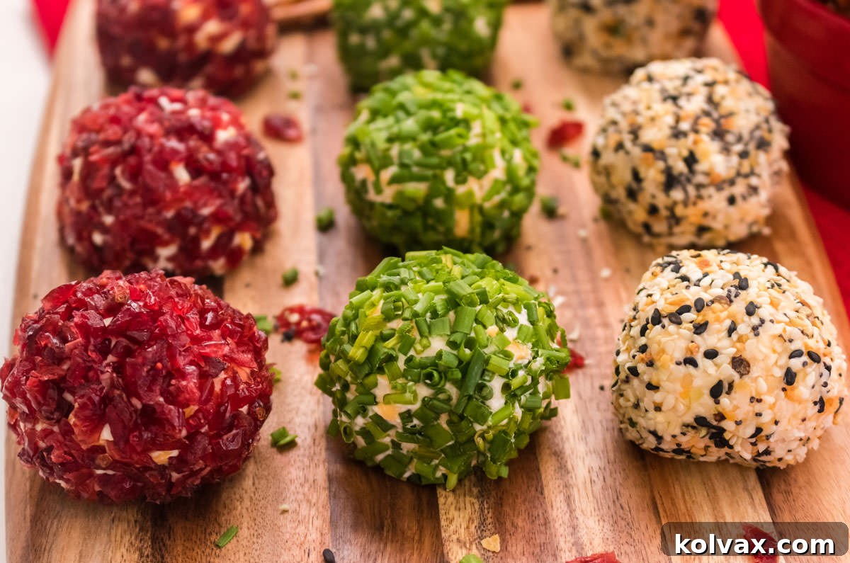 Golden Cheese Puffs 6 A beautifully arranged wooden platter showcasing three distinct flavors of Cheese Ball Bites, each with unique toppings, ready for serving.