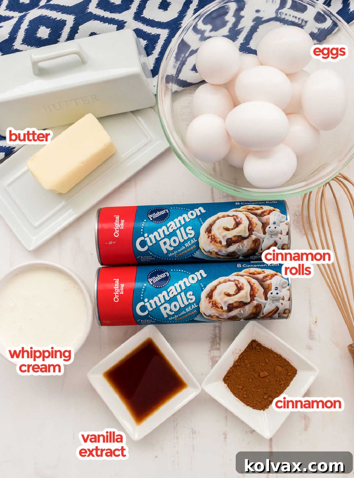 All the ingredients need to make Cinnamon Roll Breakfast Casserole including canned cinnamon rolls, eggs, butter, vanilla, cream and cinnamon.