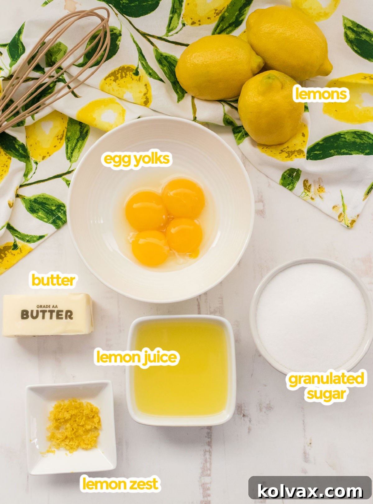 All the essential ingredients for our Easy Lemon Curd Recipe: fresh lemons, egg yolks, butter, granulated sugar, and lemon zest.