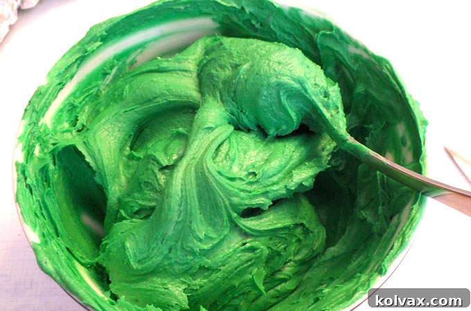 Vibrant green buttercream frosting prepared for decorating Christmas Tree Cupcakes