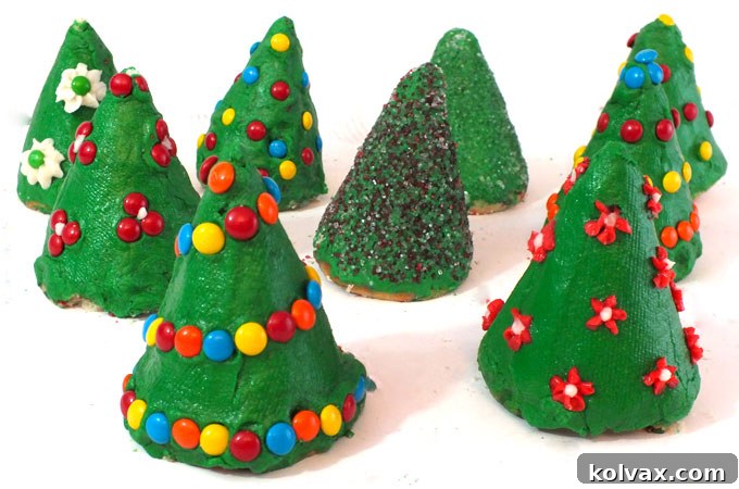 Decorating festive Christmas Tree Cupcakes with colorful candies and sprinkles