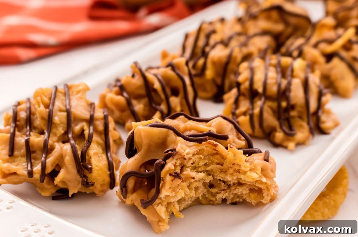 Eight Fritos Peanut Butter Cookies arranged neatly on a white serving platter, one with a bite taken out, showcasing the crunchy texture.