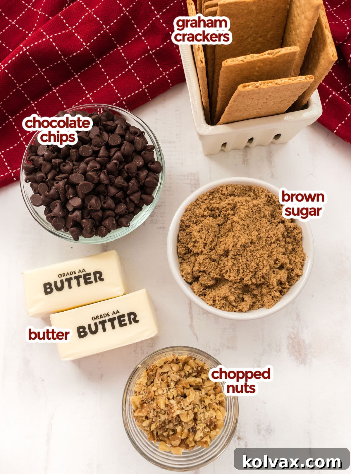 All the ingredients you will need to make Graham Cracker Toffee including Graham Crackers, Chocolate Chips, Brown Sugar, Butter and Chopped Nuts.