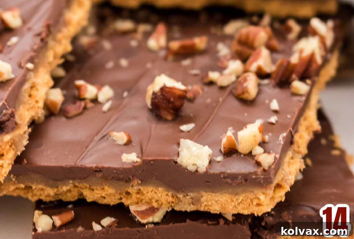Closeup on the three layers of a piece of Graham Cracker Toffee.