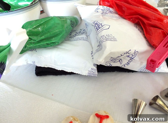 Frosting bags resting on ice packs to prevent melting during a cookie decorating session