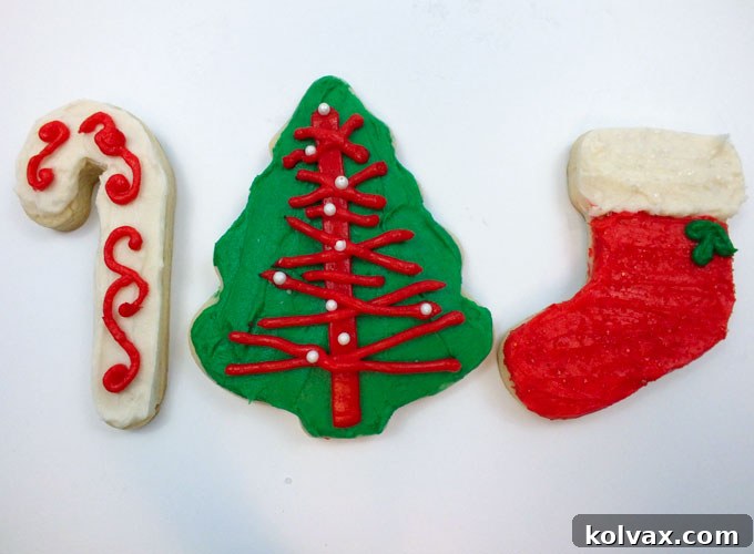 Decorated Christmas cookies, some with colorful frosting and others adorned with festive Christmas sprinkles