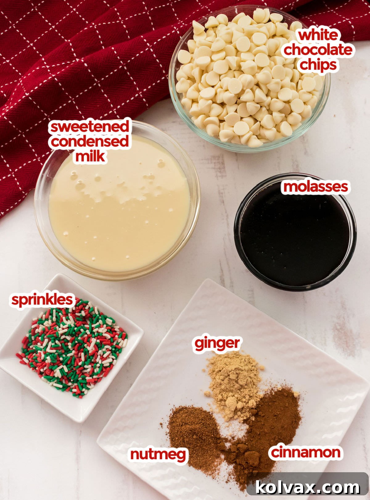 All the essential ingredients for Gingerbread Fudge laid out neatly: white chocolate chips, sweetened condensed milk, molasses, ground ginger, cinnamon, and nutmeg, ready for preparation.