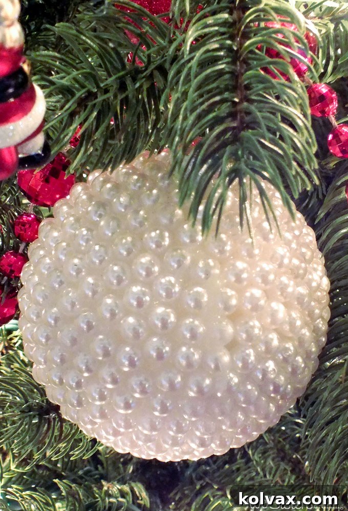Beautifully crafted DIY Pearl Christmas Tree Ornament featuring a uniform pattern of same-sized pearls, showcasing elegant holiday decor.