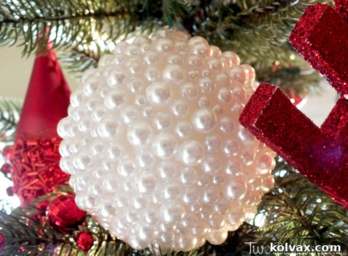 Assortment of handmade Pearl Christmas Tree Ornaments on a tree, showcasing elegant DIY holiday decor ideas.