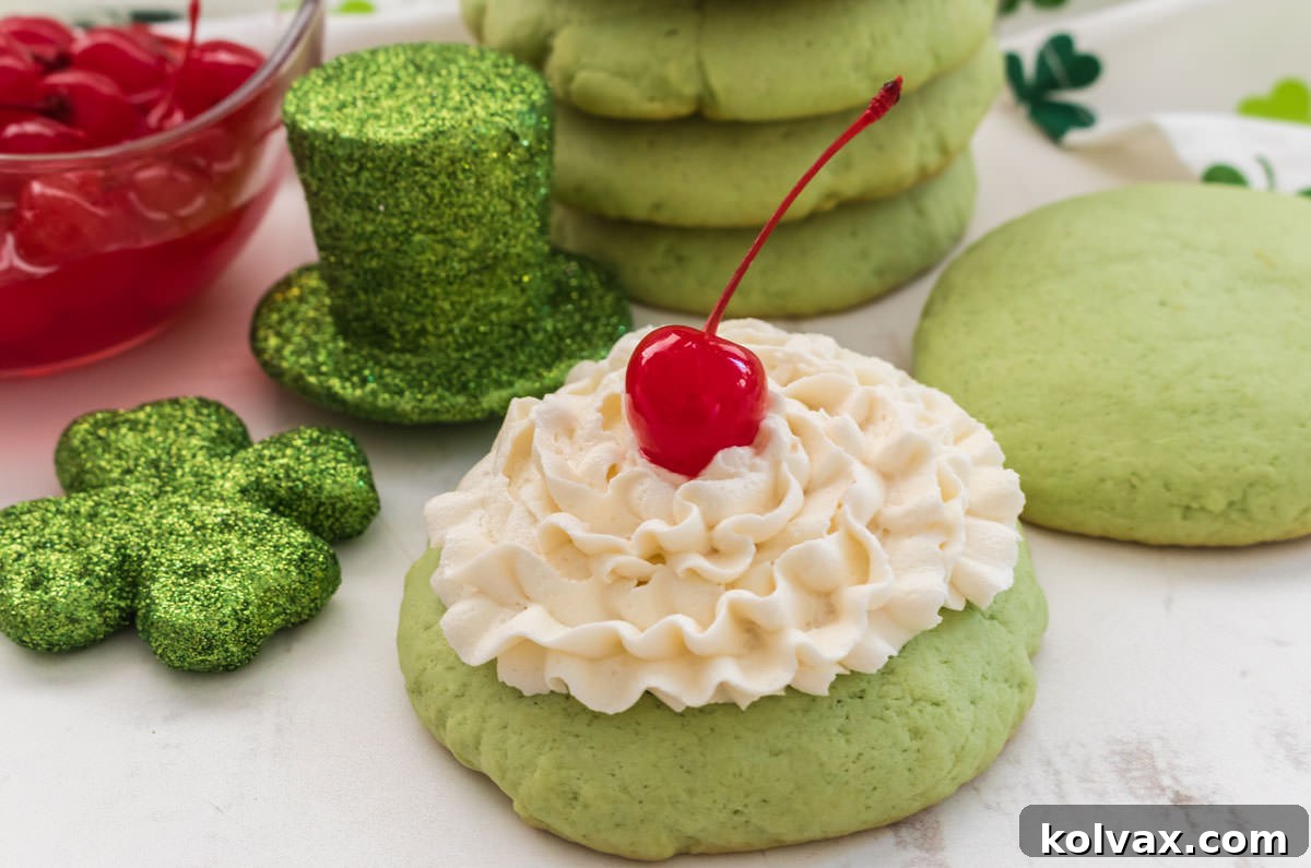 A close-up of a perfectly frosted Shamrock Shake Cookie resting on a pristine white surface, adorned with a miniature leprechaun hat and a shamrock, evoking the spirit of St. Patrick's Day.