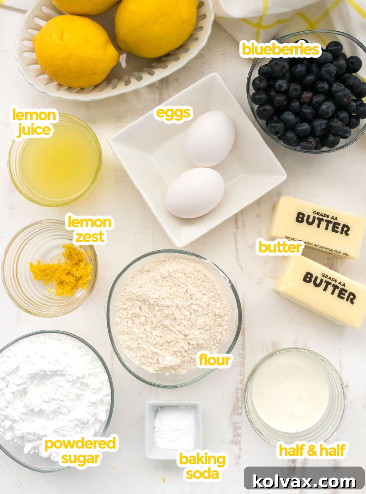 All the ingredients you will need to make Lemon Blueberry Cookies including butter, powdered sugar, eggs, lemon juice, lemon zest, Half & Half, Flour, Baking Soda and Fresh Blueberries.